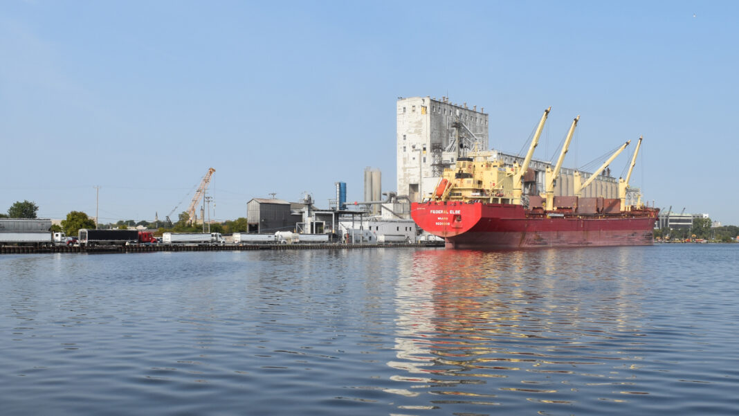COV-Logistics-Port-Athomas-0753 Trucks line up to deliver agricultural products to the privately-operated Cofco International grain elevator in the Milwaukee harbor.